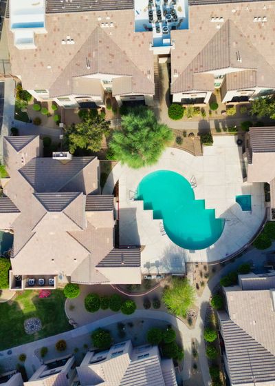 Aerial view looking down on the pool and clubhouse