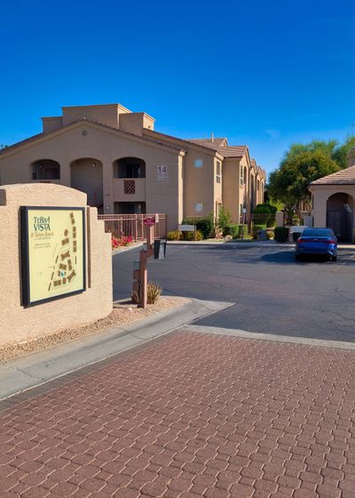 The gated entrance and drive into the community
