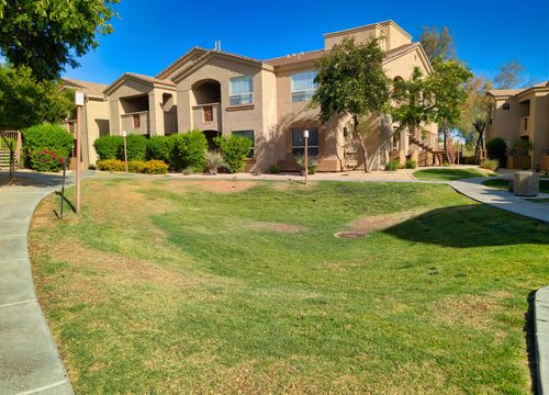 Manicured desert greenbelt between the buildings
