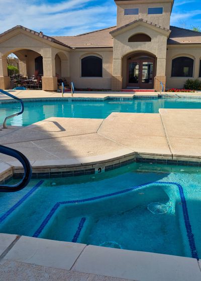 The community pool and patio on a sunny day