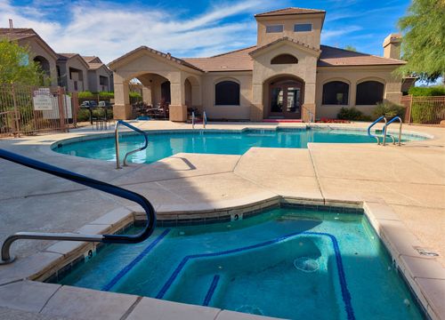 The spa and sundeck beside the pool